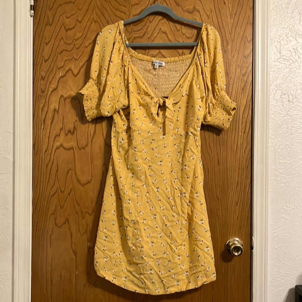 Yellow with flower design dress.